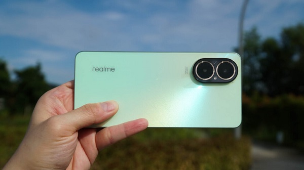 A person lying on a blanket taking a selfie

Description automatically generated