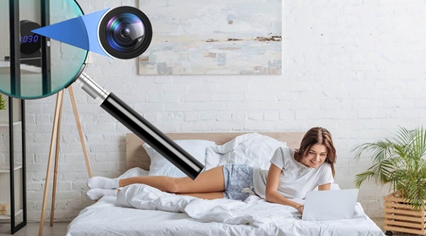 A person lying on a bed with a camera

Description automatically generated