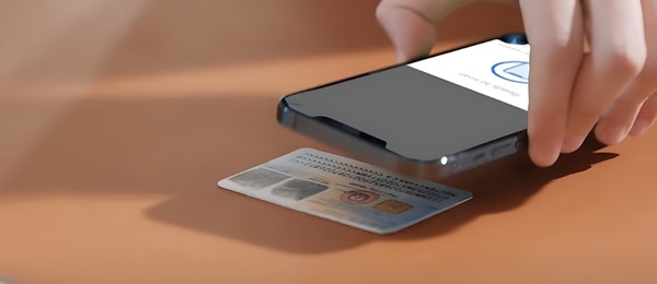 A close-up of a phone and a credit card

Description automatically generated