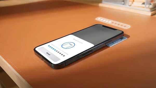 A black cell phone on a table

Description automatically generated