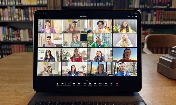 A computer with a group of people on it
Description automatically generated