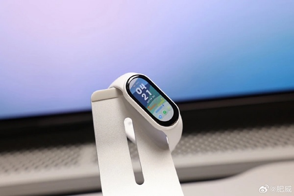 A smart watch on a stand

Description automatically generated