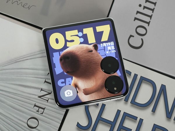 A square cell phone with a picture of a bear on it

Description automatically generated