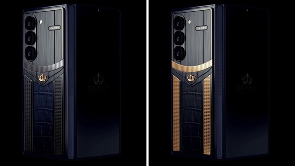 A close-up of a black and gold device
Description automatically generated