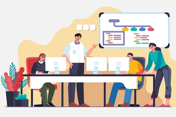 A group of people sitting at a desk with computers

Description automatically generated