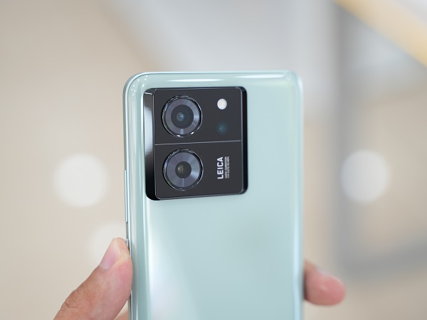 A person taking a picture of a city

Description automatically generated