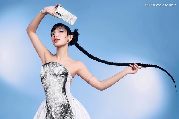 A person in a dress holding a phone

Description automatically generated