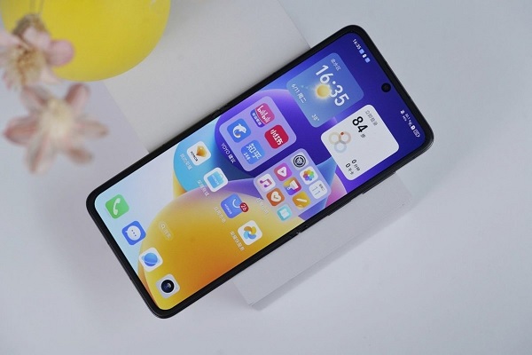 A cell phone on a stand
Description automatically generated