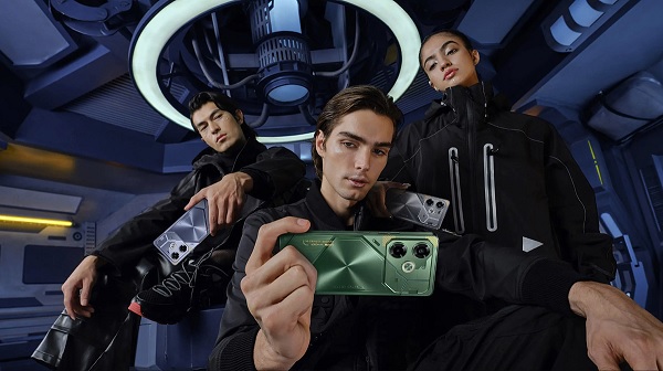 A person holding a cellphone with a group of people dancing
Description automatically generated