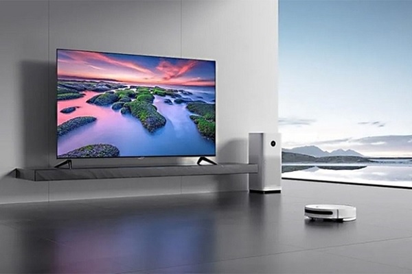 A smart tv on a stand in a room

Description automatically generated