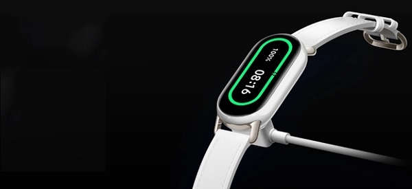 A white watch with a green digital display
Description automatically generated