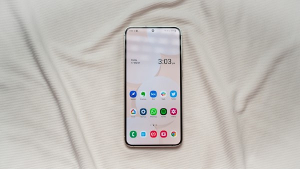 A hand holding a purple cell phone
Description automatically generated