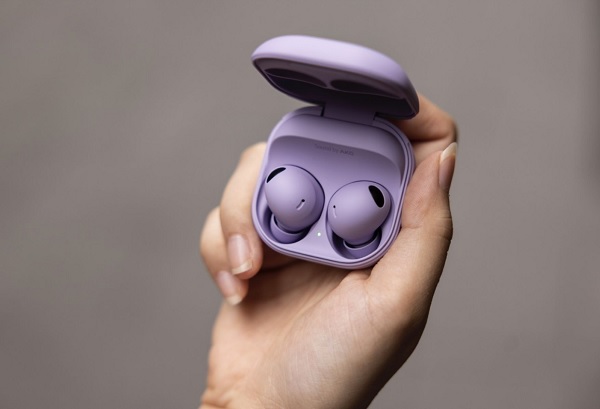 A close-up of a wireless earbuds
Description automatically generated