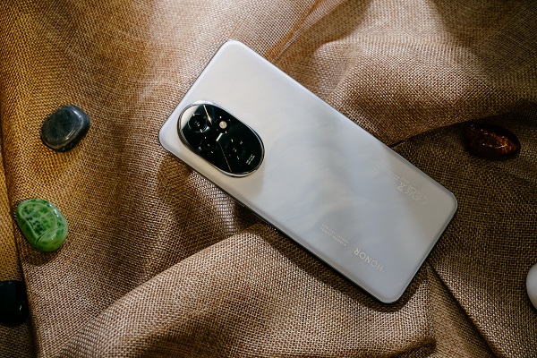 A cell phone on a cloth
Description automatically generated