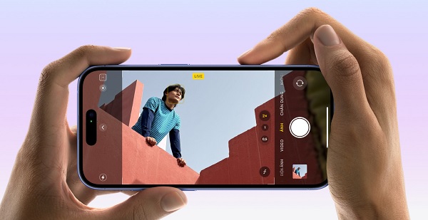 Hands holding a phone with a picture of a river
Description automatically generated