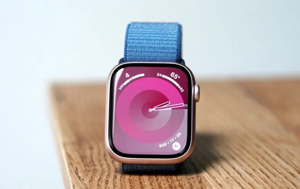 A smart watch on a computer
Description automatically generated