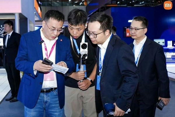 A group of men looking at a camera
Description automatically generated