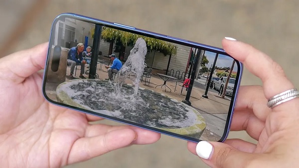 A cell phone with a video game screen
Description automatically generated