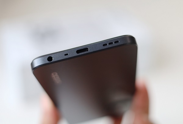 A phone on a book
Description automatically generated