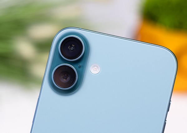 A person taking a picture of a person climbing a wall
Description automatically generated