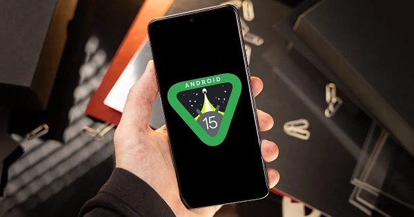 A cell phone with a logo on the screen

Description automatically generated