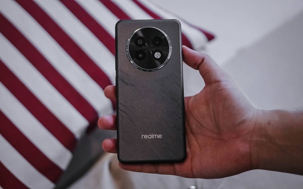 A cell phone on a striped surface
Description automatically generated