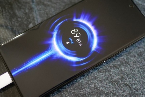 A cell phone with a blue circle and a blue light
Description automatically generated